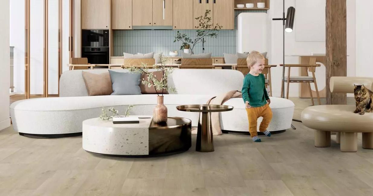 a small child standing on the floor in a living room